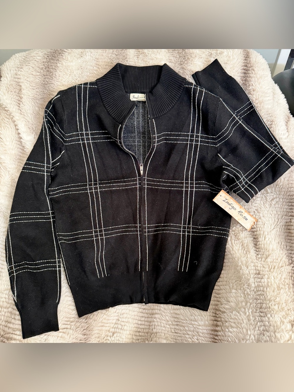 Indian Rose black grid full-zip knit sweater jacket.